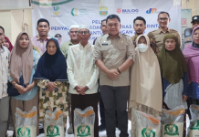 Sekda Budhi Hartono Resmi Luncurkan Penyaluran Cadangan Beras ke Masyarakat Kumpeh Ulur