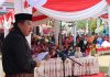 Pj Bupati Merangin Salurkan Bantuan Desa Penyangga TNKS